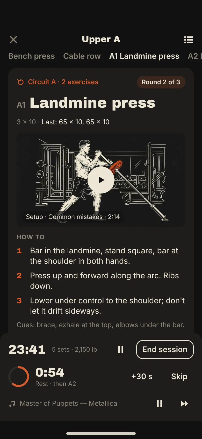 The session logger mid-circuit: landmine press, round 2 of 3, rest timer running